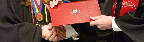 Student receiving diploma cover